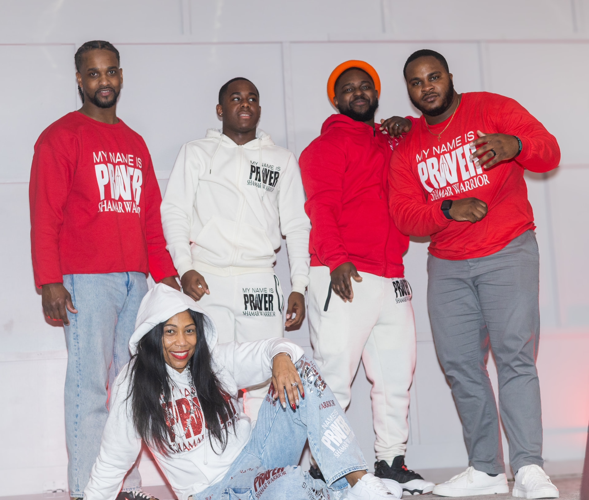 The My Name Is Prayer family in red and white Shamar Warrior apparel with Prayer baggie jeans