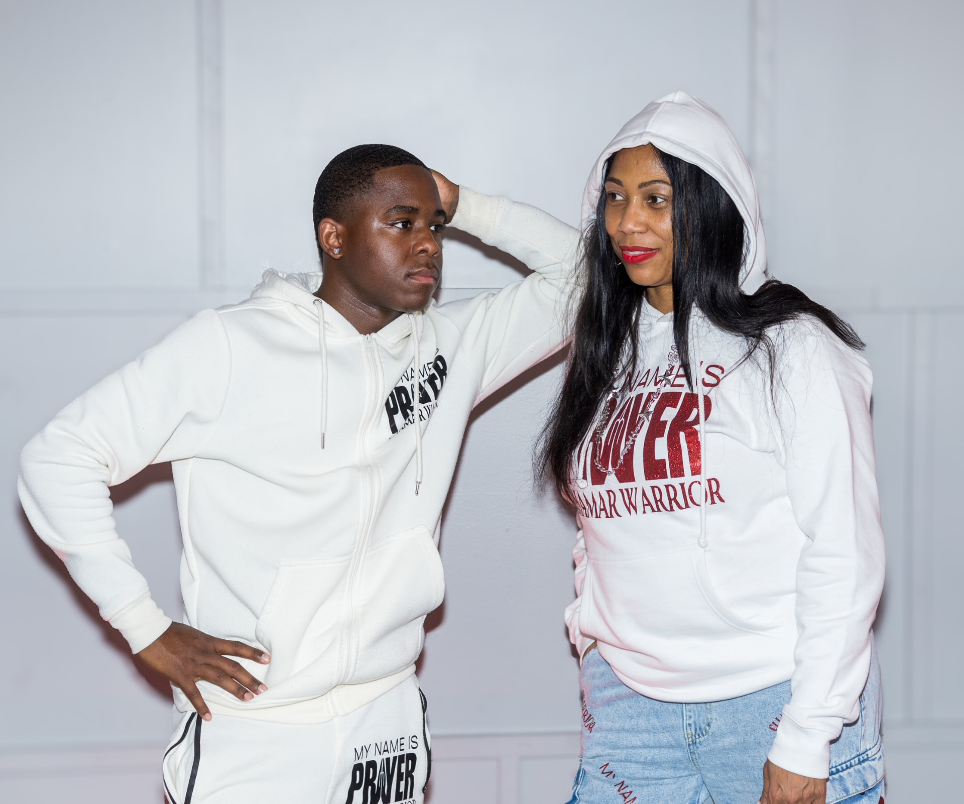 Two watchmen in white My Name Is Prayer Shamar Warrior hoodies and sets
